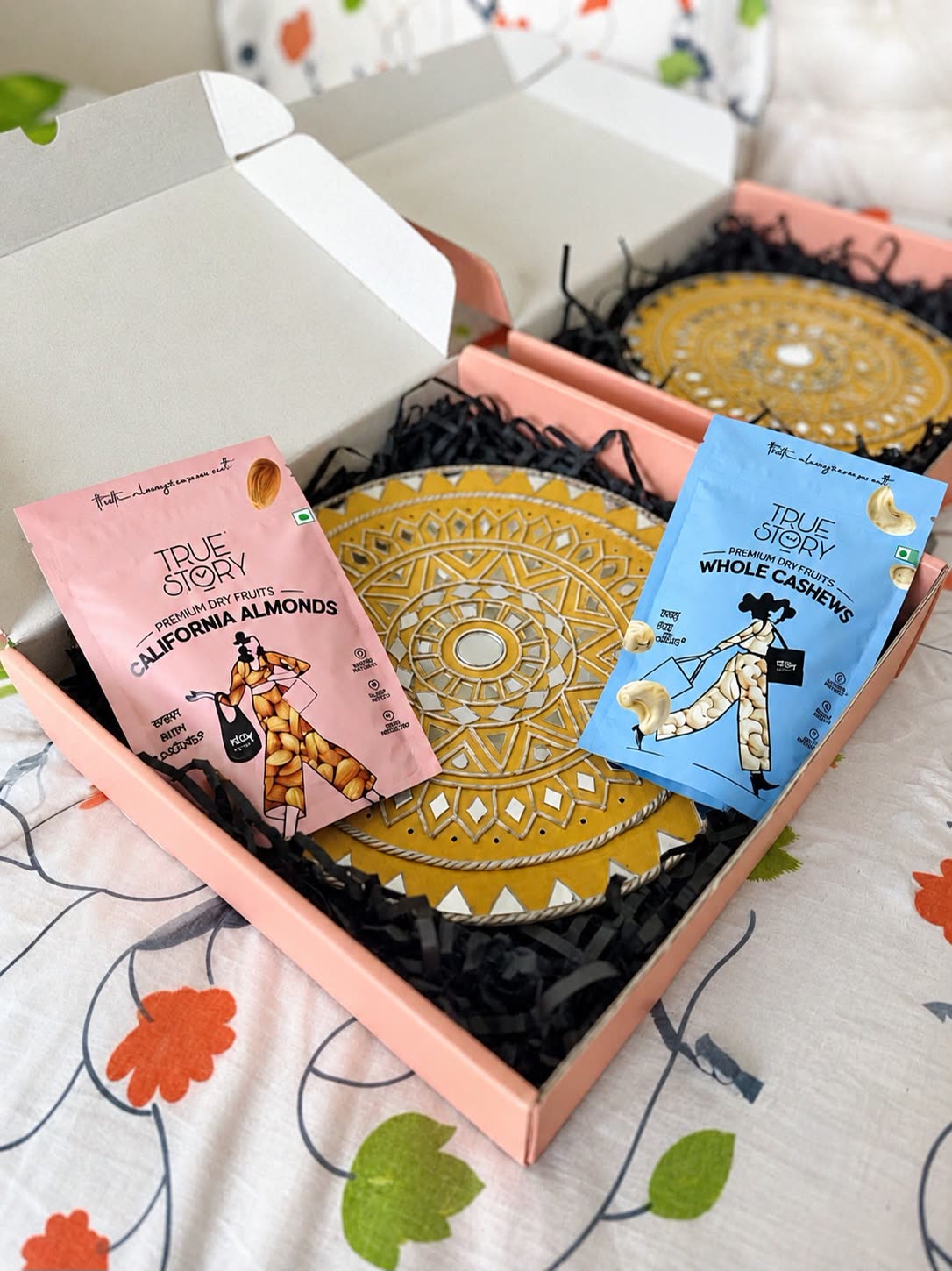 Swarna Chakra Gift Box — Mustard Wall Hanging with Dry Fruits — handmade 12-inch mustard lippan wall hanging with 100g california almonds & 100g whole cashews in gift box by Rachna Saxena