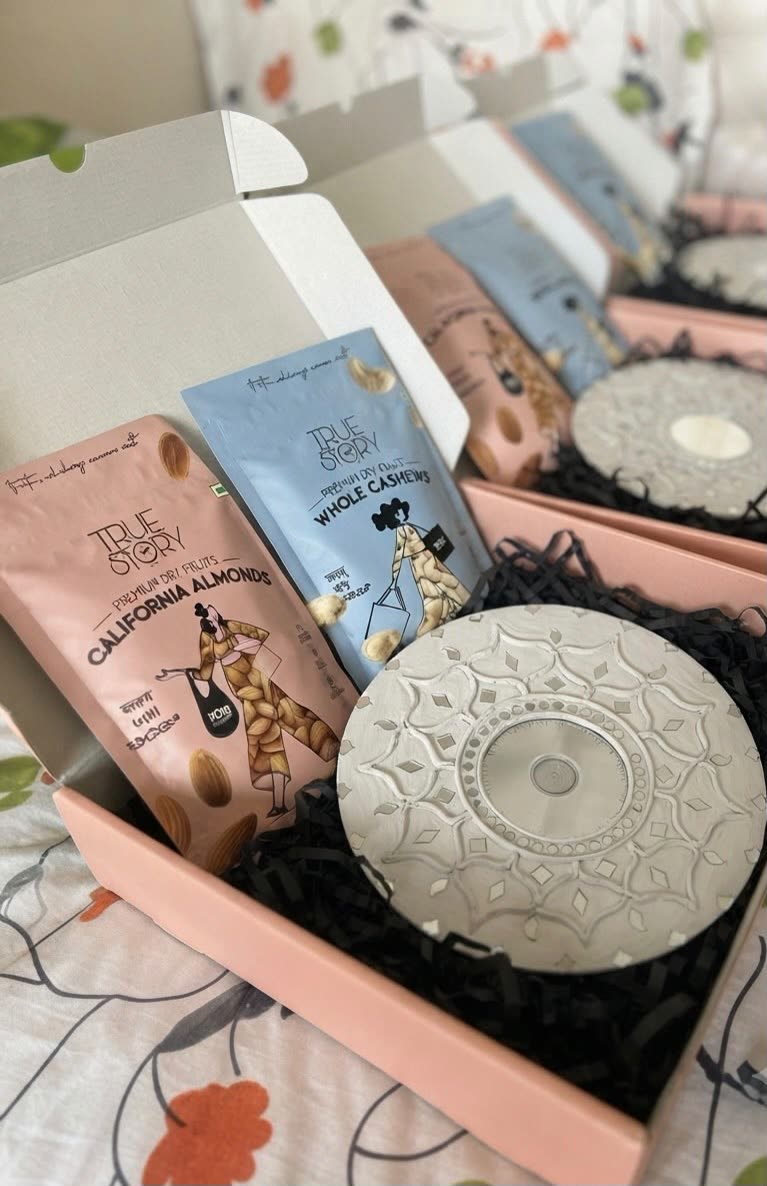 Shwet Kamal Gift Box — White Wall Hanging with Dry Fruits — handmade 12-inch white lippan wall hanging with 100g california almonds & 100g whole cashews in gift box by Rachna Saxena